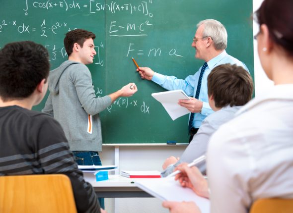A teacher teaching students in a classroom