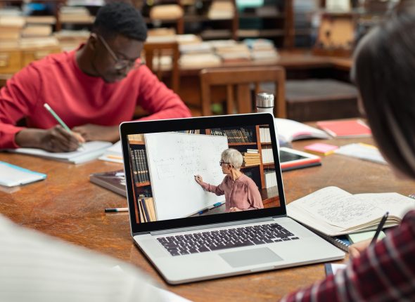 Student watching online video lesson